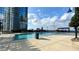 A pristine rooftop pool in a luxury building with a view of the city skyline at 400 W Peachtree Nw St # 2808, Atlanta, GA 30308