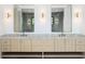 Bathroom with double vanity, marble countertop, modern mirrors and lights at 401 Lynne Cir, Alpharetta, GA 30009