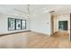Bright bedroom with a tray ceiling, large window, and access to the hallway at 401 Lynne Cir, Alpharetta, GA 30009