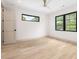 Light-filled bedroom with hardwood floors, complemented by modern windows and neutral décor at 401 Lynne Cir, Alpharetta, GA 30009