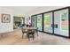Dining area with large sliding doors to the patio and view of outdoor fireplace at 401 Lynne Cir, Alpharetta, GA 30009
