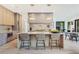 Open kitchen with island seating, modern fixtures, and stainless steel appliances at 401 Lynne Cir, Alpharetta, GA 30009