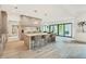 Contemporary kitchen with island seating, stainless appliances, and backyard access at 401 Lynne Cir, Alpharetta, GA 30009