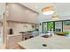 Gourmet kitchen with a marble backsplash, stainless steel range, and a view of the backyard at 401 Lynne Cir, Alpharetta, GA 30009