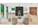 Bright living room with hardwood floors, modern fireplace, and designer furnishings at 401 Lynne Cir, Alpharetta, GA 30009