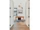 Office with hardwood floors, a desk, a light fixture, and a window at 401 Lynne Cir, Alpharetta, GA 30009