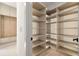 Walk-in pantry with custom shelving and storage solutions for organized kitchen supplies at 401 Lynne Cir, Alpharetta, GA 30009