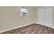 Bedroom with light walls, wood floors, and closet at 1729 James Burgess Rd, Suwanee, GA 30024