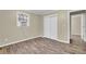 Bedroom with light walls, wood floors, and closet at 1729 James Burgess Rd, Suwanee, GA 30024