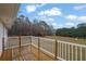 Exterior view of deck with wood floors and white railing at 1729 James Burgess Rd, Suwanee, GA 30024