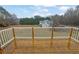 Exterior of deck with wood floors and white railing at 1729 James Burgess Rd, Suwanee, GA 30024