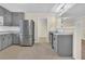 Updated kitchen with stainless appliances, gray cabinets, and convenient pass-through at 1729 James Burgess Rd, Suwanee, GA 30024