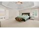 Expansive primary bedroom suite with tray ceilings, sitting area, and bright natural light at 7215 Gresham Trce, Cumming, GA 30040