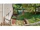 Stone pathway with beautiful landscaping and lush greenery leads to the house at 7215 Gresham Trce, Cumming, GA 30040