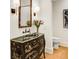 Powder room showcasing artistic dark vanity with gold accents and a unique vessel sink at 2500 Peachtree Nw Rd # 606N, Atlanta, GA 30305