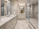 Luxurious bathroom features double vanity and a spacious glass-enclosed shower with a rainfall shower head at 2500 Peachtree Nw Rd # 606N, Atlanta, GA 30305