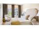 Inviting bedroom with neutral colors and a large window that provides natural light and stunning city views at 2500 Peachtree Nw Rd # 606N, Atlanta, GA 30305