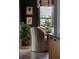 An eat-in kitchen features a dark accent wall and modern design at 2500 Peachtree Nw Rd # 606N, Atlanta, GA 30305