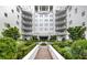 Stunning exterior view of a multi-story building with manicured landscaping and a central fountain at 2500 Peachtree Nw Rd # 606N, Atlanta, GA 30305