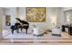 Comfortable lobby seating area with a grand piano and stylish artwork at 2500 Peachtree Nw Rd # 606N, Atlanta, GA 30305