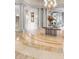 Stunning lobby featuring marble floors, high ceilings, a chandelier, columns, and circular design at 2500 Peachtree Nw Rd # 606N, Atlanta, GA 30305