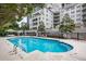 Beautiful outdoor pool with lounge chairs and views of the building's elegant architecture at 2500 Peachtree Nw Rd # 606N, Atlanta, GA 30305