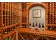 Climate controlled wine cellar with custom wood racking, display shelf, and arched entrance feature at 2500 Peachtree Nw Rd # 606N, Atlanta, GA 30305