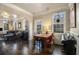 Open-concept: Dining room connects to living area, featuring hardwood floors and natural light at 1530 Oakview Rd, Decatur, GA 30030