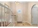 Entryway featuring tile flooring, staircase, and arched doorway into main living space at 1530 Oakview Rd, Decatur, GA 30030