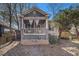 Inviting home showcasing a cozy front porch with stylish curtains and a meticulously maintained stone base at 1530 Oakview Rd, Decatur, GA 30030