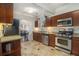 Cozy kitchen with stainless steel appliances and travertine floors at 1530 Oakview Rd, Decatur, GA 30030