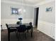 Elegant dining room with contemporary lighting and stylish decor, ideal for entertaining guests at 204 Hightower Trl, Riverdale, GA 30274