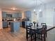 Open kitchen and dining area featuring modern appliances and a functional center island at 204 Hightower Trl, Riverdale, GA 30274