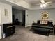 Spacious main bedroom with a desk and large area for a dresser, with decor and ceiling fan at 204 Hightower Trl, Riverdale, GA 30274
