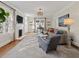 Cozy living room featuring hardwood floors, a fireplace, and ample seating, perfect for relaxation at 549 Lakeshore Ne Dr, Atlanta, GA 30307