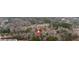 An aerial view of a community shows the layout with tree-lined streets and ample green space at 80 Holder St, Temple, GA 30179