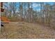 A spacious backyard with a wooden staircase at 80 Holder St, Temple, GA 30179