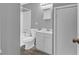 Standard bathroom with shower-tub combo, white vanity, and coordinating toilet at 80 Holder St, Temple, GA 30179