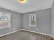 Bright bedroom featuring neutral paint and luxury vinyl flooring, enhanced by natural light at 80 Holder St, Temple, GA 30179