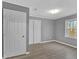 A bedroom featuring gray walls, new hardwood floors, and a closet at 80 Holder St, Temple, GA 30179