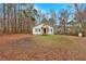 Lovely one-story home surrounded by trees and a spacious yard, offering privacy and outdoor space at 80 Holder St, Temple, GA 30179