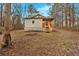 Cozy home featuring a charming front porch, a small window and mature trees in a leafy yard at 80 Holder St, Temple, GA 30179