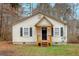 Inviting one-story home with a quaint front porch, black shutters, and a well-maintained lawn at 80 Holder St, Temple, GA 30179