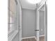 A hallway with gray walls, hardwood floors, and a window at 80 Holder St, Temple, GA 30179