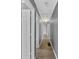 Hallway with doors and luxury vinyl flooring with updated paint at 80 Holder St, Temple, GA 30179