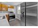 Kitchen with a stainless steel refrigerator, oven, and white countertops at 80 Holder St, Temple, GA 30179