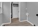 A laundry room with gray walls and a doorway to the bathroom at 80 Holder St, Temple, GA 30179