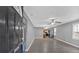 Bright, open-concept living space with modern gray walls and sleek, updated flooring at 80 Holder St, Temple, GA 30179