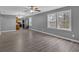 Spacious living area with modern flooring, gray walls, and large windows providing ample natural light at 80 Holder St, Temple, GA 30179