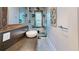 Modern bathroom featuring a glass shower, art, and wall mounted fixtures at 1112 Austin Ne Ave, Atlanta, GA 30307